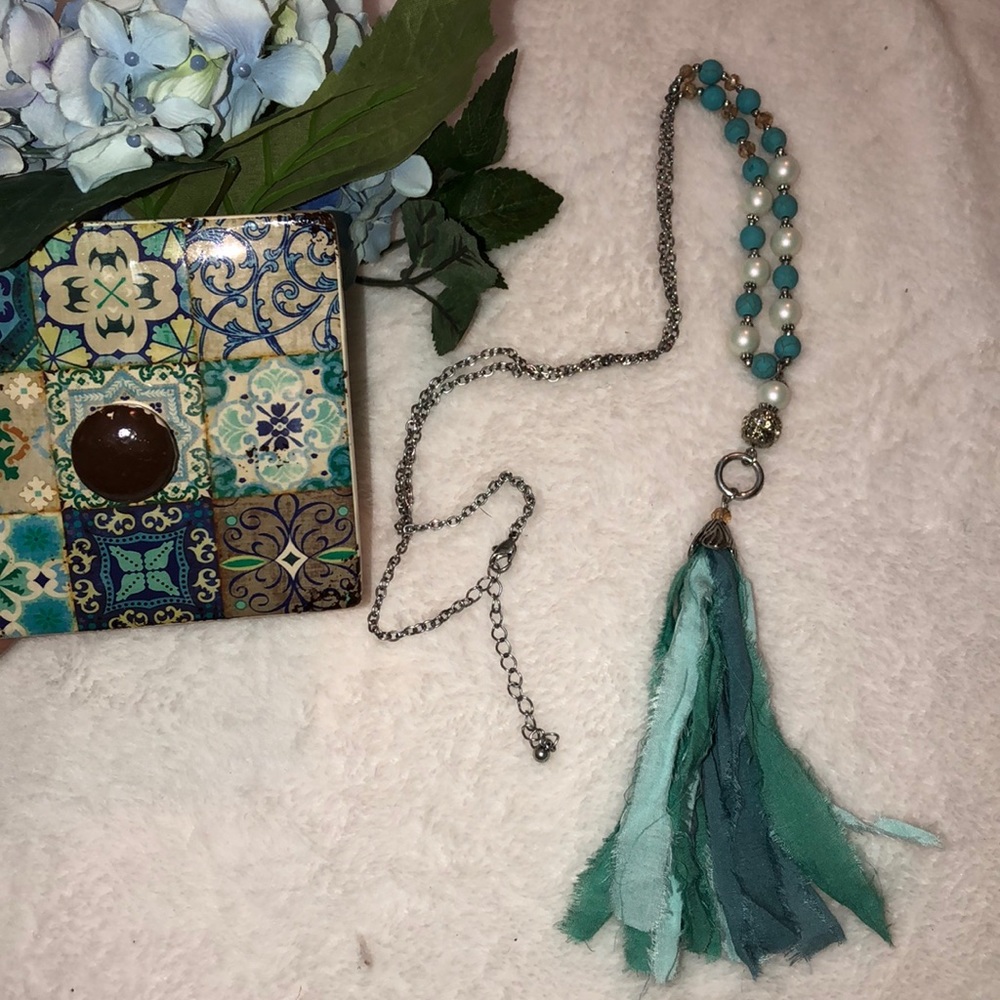Long tassel accent necklace.
